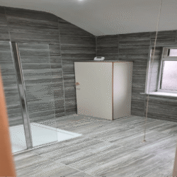 Bathroom (After): Bathroom after a thorough renovation. The installation of new boiler box, S/F new bathroom units, flooring, wall & floor tiles, and complete décor.